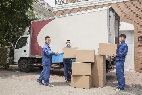 Student removals team working in Elephant and Castle near modern apartment buildings
