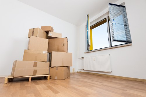 Professional team handling sofas, beds, and wardrobes during a South London move