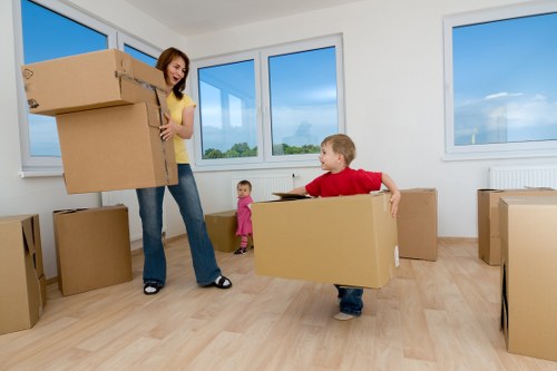 Boxes and furniture being loaded into a moving van