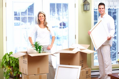Boxes and donated household items prepared for charity reuse during a clearance